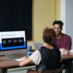 NetSuite Training - team having a meeting with laptops on the table